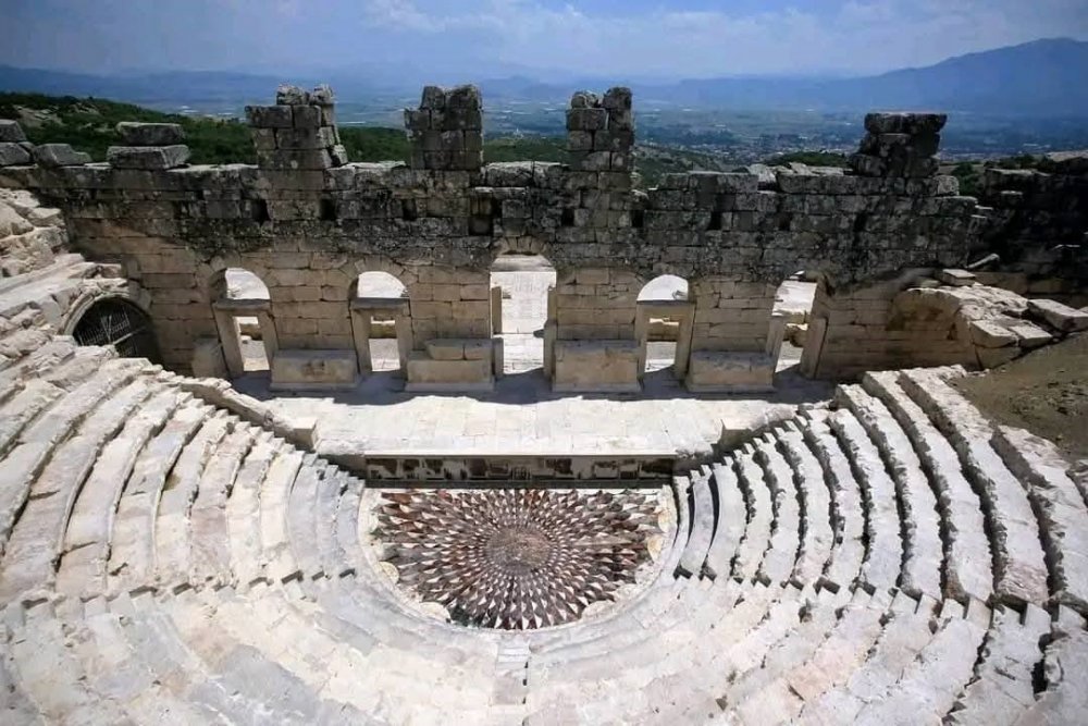 The colorful Medusa mosaic made of marble pieces located in the orchestra section of the Odeon (Bouleuterion) building of Kibyra Ancient City.