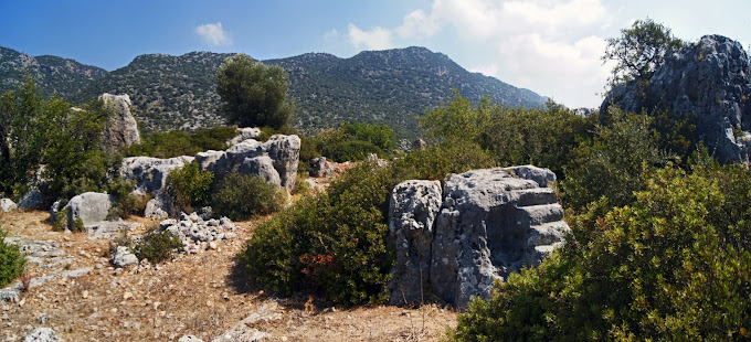 The ruins of the Temple of Apollo of Tyberissos Ancient City and the landscape of Çevreli.