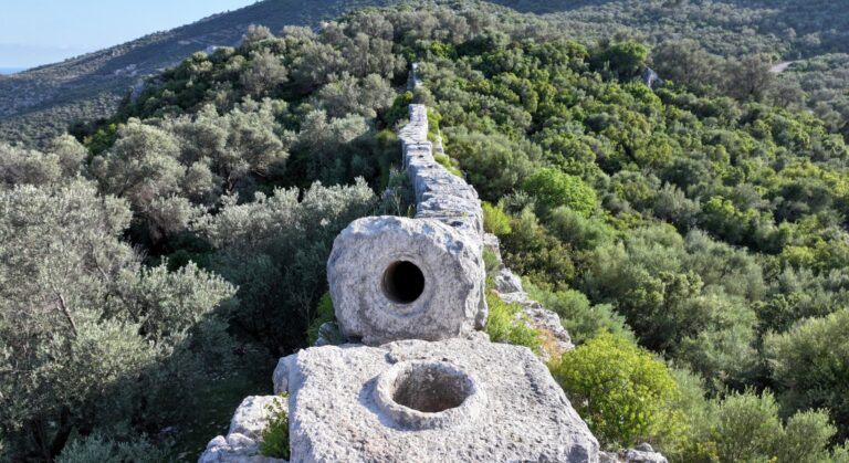 Stone blocks of the Patara Delikkemer inverted siphon pipeline, a prime example of Lycian Ancient Water Structures.