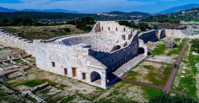 General view of the Patara Parliament Building, the administrative center of the Lycian League, after restoration, and the ancient theater structure.