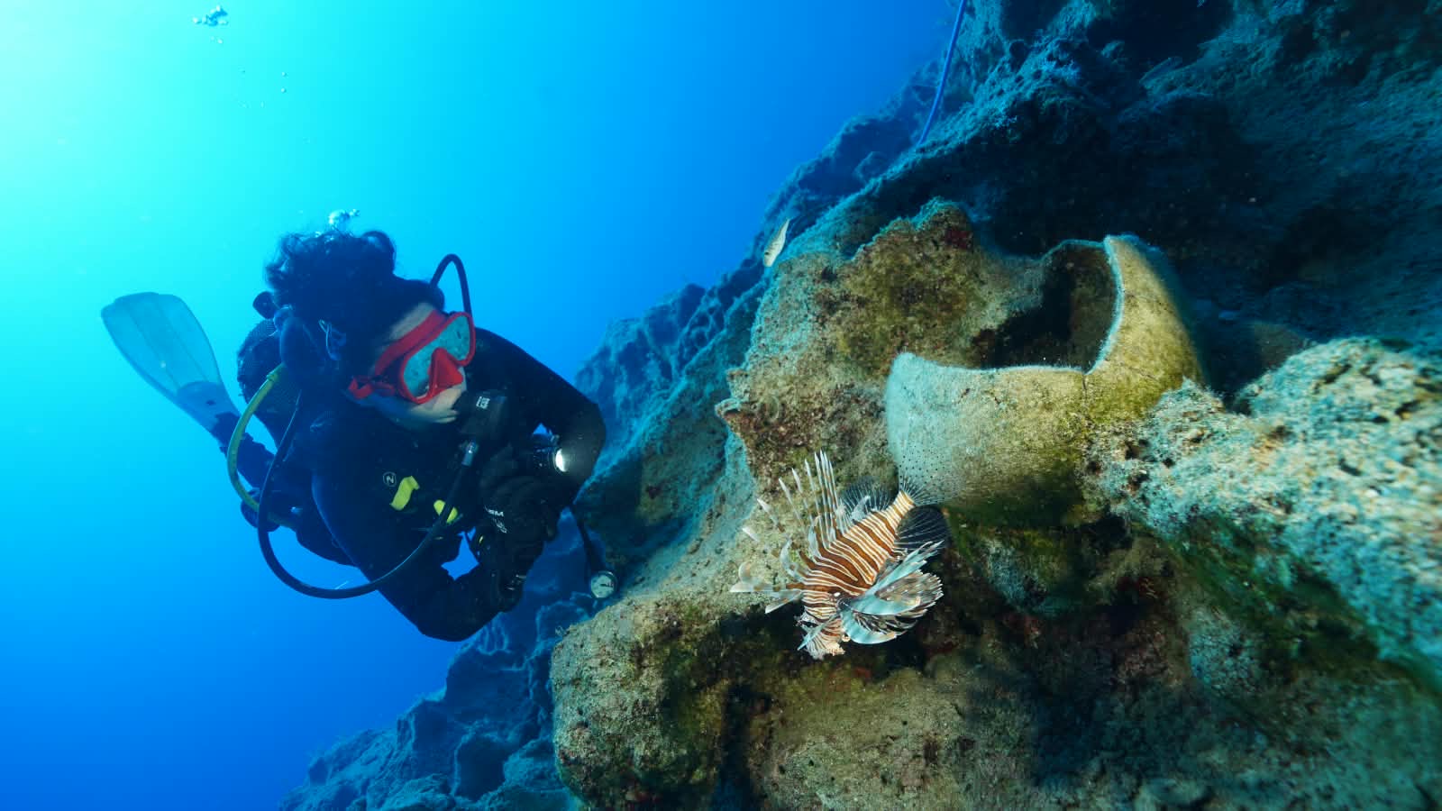 Early Bronze Age amphora in situ at the Kekova shipwreck, with a diver